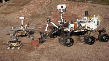 Три поколения Mars Exploration Rover (MER) в Центре управления полетами в Пасадене Три поколения Mars Exploration Rover (MER) в Центре управления полетами в Пасадене