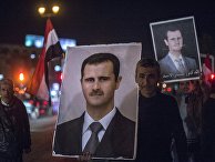 Плакат с изображением президента Сирии Башара Асада на одной из улиц Дамаска Плакат с изображением президента Сирии Башара Асада на одной из улиц Дамаска