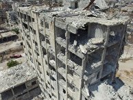 Разрушенное здание в квартале Бани-Зейд на севере Алеппо