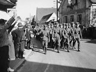 Отряд немецких войск в деревне Либенштайн, 1938 год Отряд немецких войск в деревне Либенштайн, 1938 год