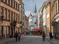 Улица Пилс и Церковь Скорбящей Богоматери в Риге, Латвия Улица Пилс и Церковь Скорбящей Богоматери в Риге, Латвия