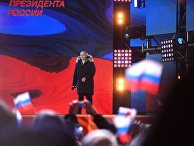 Владимир Путин во время митинга-концерта на Манежной площади в Москве Владимир Путин во время митинга-концерта на Манежной площади в Москве