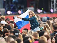 Участники во время Фестиваля болельщиков Fan Fest 2018 на Воробьевых горах в Москве Участники во время Фестиваля болельщиков Fan Fest 2018 на Воробьевых горах в Москве