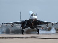 Российский самолет Су-30 совершает посадку на авиабазе "Хмеймим" в Сирии Российский самолет Су-30 совершает посадку на авиабазе "Хмеймим" в Сирии
