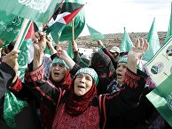Палестинцы на египетско-израильской границе в ожидании обмена пленных Палестинцы на египетско-израильской границе в ожидании обмена пленных