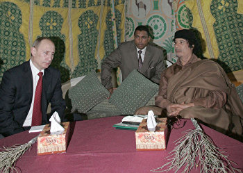 Президент России Владимир Путин и лидер ливийской революции Муамар Каддафи Президент России Владимир Путин и лидер ливийской революции Муамар Каддафи