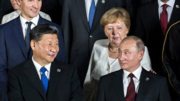 Канцлер Германии Ангела Меркель, президент России Владимир Путин, председатель КНР Си Цзиньпин во время саммита G20 в Осаке