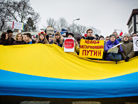 Участники акции протеста в Варшаве, Польша Участники акции протеста в Варшаве, Польша
