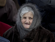 Пожилая женщина в Кишиневе, Молдова Пожилая женщина в Кишиневе, Молдова