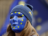 Участница акции протеста в Лондоне Участница акции протеста в Лондоне
